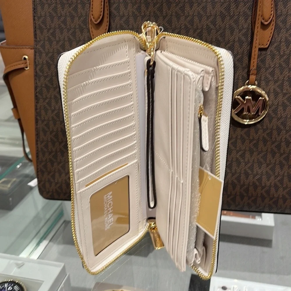 MICHAEL KORS LARGE TRAVEL CONTINENTAL WRISTLET WALLET OPTIC WHITE COLOR